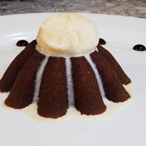 Chocolate lava cake with vanilla icecream, strawberry and banana topping  Stock Photo - Alamy
